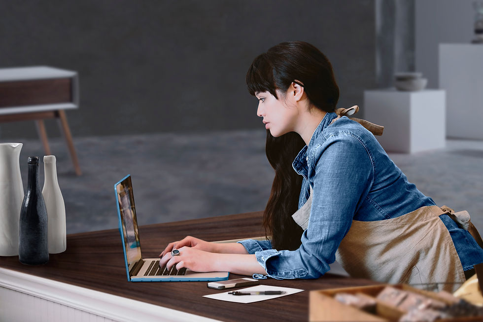 Women working on a grant on her laptop