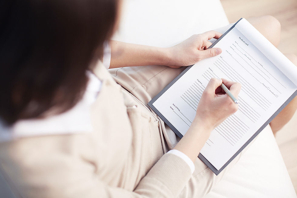 Person reviewing a grant application with notes and checklist